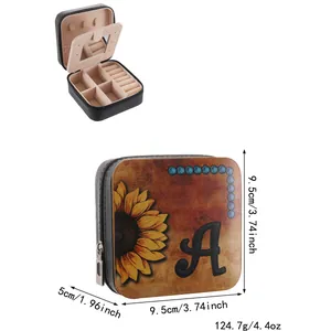 Detailed close-up view of a square jewelry box featuring a sunflower and initial A imprint