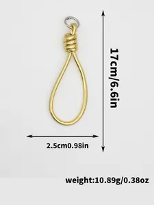 Macro view of gold PU leather braided keychain with specific dimensions and weight info