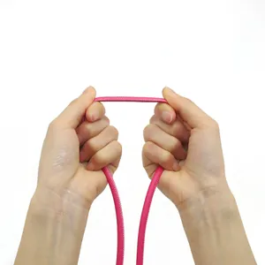 Detail shot of pink cross-grain PU stitched rope showing material flexibility.