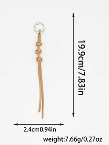 Detailed view of handmade braided cowhide leather keychain with size and weight