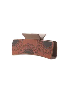 Detailed view of the vintage sunflower pattern on this PU leather hair claw clip