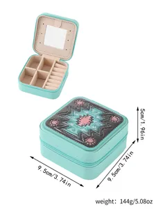 Portable mint green square jewelry organizer with mirror and embossed pattern details.