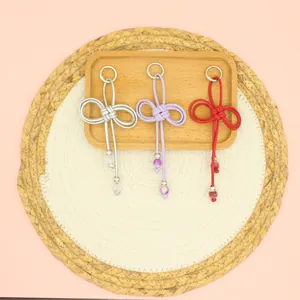 Close-up of hand-woven beaded PU cord charms in three elegant colors