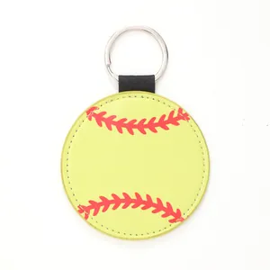 Detailed close-up of a yellow faux leather keychain featuring red softball stitching.