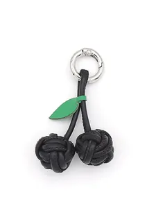 Handmade PU leather cherry bag charm with black woven balls detail
