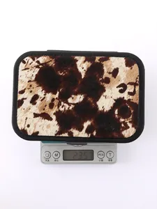 Western style cow print jewelry box weighing approximately 235.7g on electronic scale