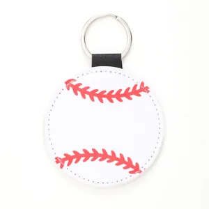 Close-up detail of a round white leather keychain featuring a red baseball stitch pattern