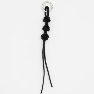 Handmade black braided cowhide leather keychain charm with minimalist knotted design