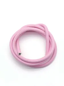 Detailed view of pink cross-grain PU leather cord for DIY keychain and bag accessories