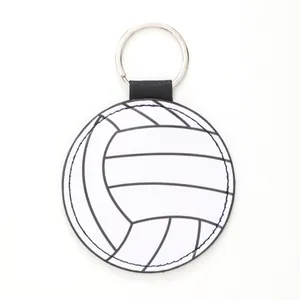 Macro detail of a circular white volleyball leather keychain with precise black stitching