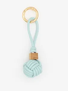Detail of handmade woven PU leather ball charm with light blue rope and wooden bead