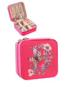Compact pink jewelry organizer with floral letter B print and zipper closure.
