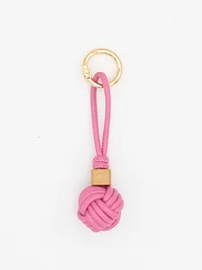 Detailed view of a pink PU leather braided ball keychain with a wooden bead accent