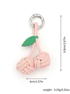 Handmade pink PU cherry keychain detail showing dimensions of 6.8cm height and 4cm width