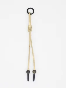 Detailed view of a handmade woven PU leather cord keychain with decorative beads and ring