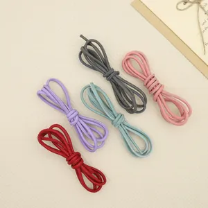 Close-up of DIY stitched round cords in various colors featuring a matte retro texture