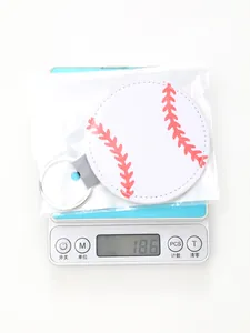 Detailed shot of a sports baseball patterned leather keychain weighing 18.6 grams on a scale
