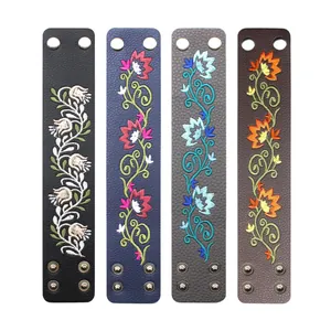 Detailed close-up view of four colorful floral embroidered PU leather ethnic style bracelets