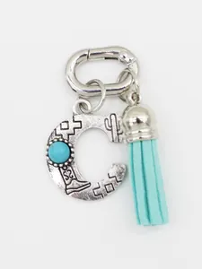 Southwestern style letter C bag charm with turquoise stone and blue tassel detail