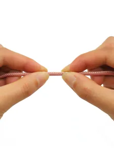 Close-up of pink matte vintage stitched round cord showing durable thread details