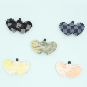 Detailed view of DIY denim plaid and sequin double heart charms in multiple colors.