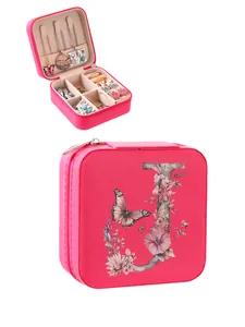 Portable pink jewelry box with floral 'J' letter design and butterfly pattern detail