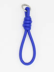 Close-up of bright blue PU leather braided hand strap with silver metal ring