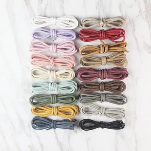 Variety of matte stitched round leather cords for DIY crafts and jewelry making.