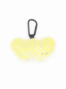 Detailed close-up of yellow denim double heart keychain with shimmering silver sequins