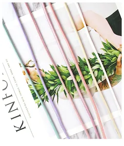 Close-up of colored matte round leather cords with vintage sewing texture detail