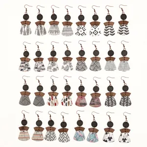 Detailed view of bohemian multi-layered cork earrings with diverse geometric patterns