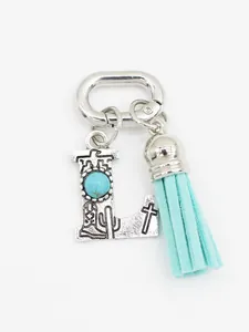 Detailed view of Western style letter L charm with turquoise and light blue tassel