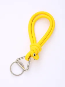 Yellow hand-woven PU leather phone strap with silver triangular carabiner detail.
