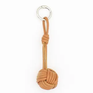Premium handmade woven tan PU leather knot ball keychain bag charm with silver ring