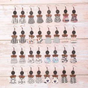 Collection of Bohemian layered cork earrings with geometric patterns and wood accents
