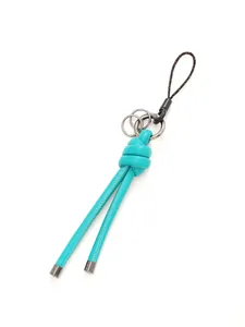 Close-up detail of a turquoise handmade braided leather knot keychain with metal rings