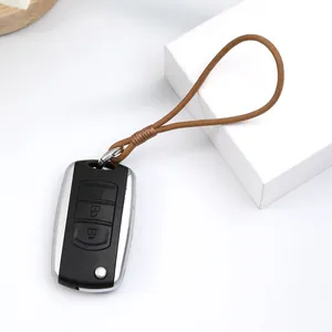 Detail of handmade brown leather wrist strap lanyard with metal ring on car key