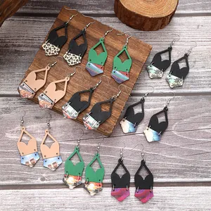 A detailed display of various bohemian geometric cork earrings featuring colorful artistic prints