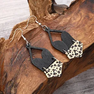 Detailed close-up showing texture of Bohemian geometric wood earrings with leopard print cork