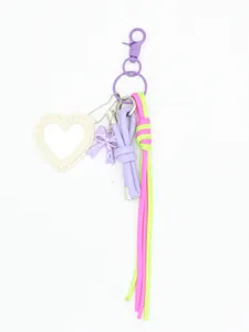 Detailed macro shot of heart-shaped leather mirror keychain with neon braided cord and bow