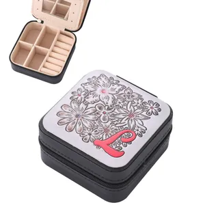 Portable zippered jewelry box with embossed floral pattern and pink letter L for rings.