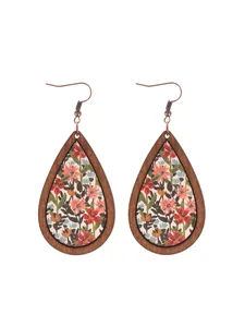 Detailed close-up view of bohemian teardrop wooden earrings with vintage floral print