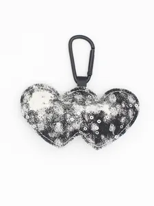 Detail of double heart denim keychain with sequins and black carabiner hook.