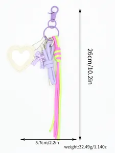 Detailed view showing the heart mirror and braided cords of the purple keychain.