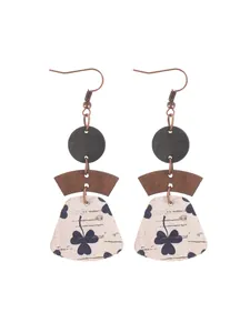 Bohemian style layered geometric patchwork cork earrings with dark shamrock pattern details