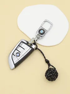 Handmade black polyester monkey fist knot woven key charm with silver clasp detail view