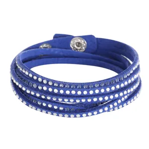 Close-up detail of a blue multi-layer wrap bracelet with sparkling rhinestone studs