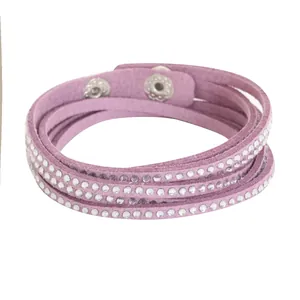 Detail view of purple multi-layer rhinestone bracelet with secure snap closures.