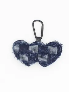 Close-up of double heart denim keychain with frayed edges and a black carabiner clip