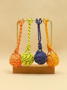 Detailed view of handmade polyester monkey fist knot charms in four bright colors